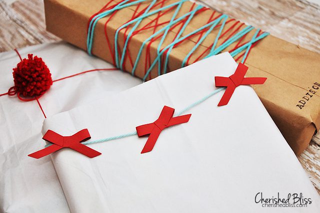 Gift Wrapping Ideas - wrapping with paper bow garland via cherishedbliss.com #Christmas #wrapping #craft