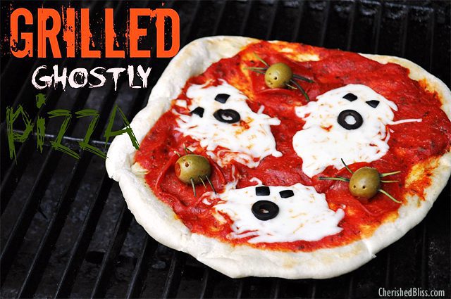 Grilled Halloween pizza with cheese ghosts and olive spiders. Too cute! The kids will love this! : ) 