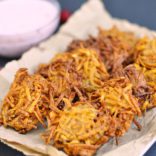 A Sweet Potato Latkes recipe with a Cranberry Jalapeno Dip that adds a delicious and spicy twist