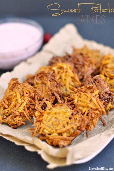 A Sweet Potato Latkes recipe with a Cranberry Jalapeno Dip that adds a delicious and spicy twist