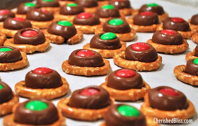A fun treat for the holidays! Everyone is sure to love these M&M Kissed Pretzels! 