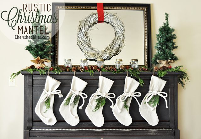 A Rustic Christmas Mantel featuring real cedar garland and drop cloth stockings