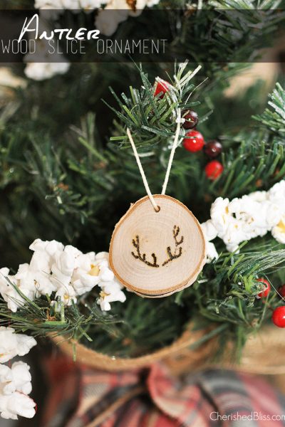Add a rustic touch to your Christmas tree this year with these easy to make Antler Wood Slice Ornaments. Tutorial via cherishedbliss.com