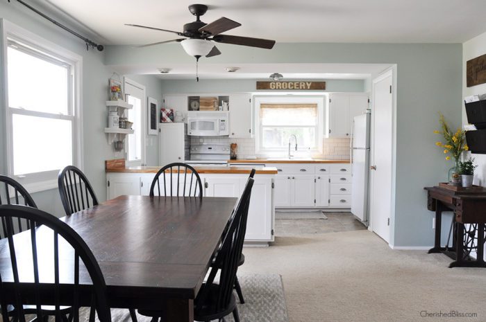 Before - This industrial farmhouse kitchen is both functional and inviting. Stainless steel appliances bring a professional industrial look while adding softer elements provides the comfort of a farmhouse. 