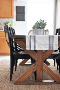 This easy to build Farmhouse Table is the perfect addition to any dining or breakfast room. With it's industrial touches and farmhouse style you will love serving meals at this table!