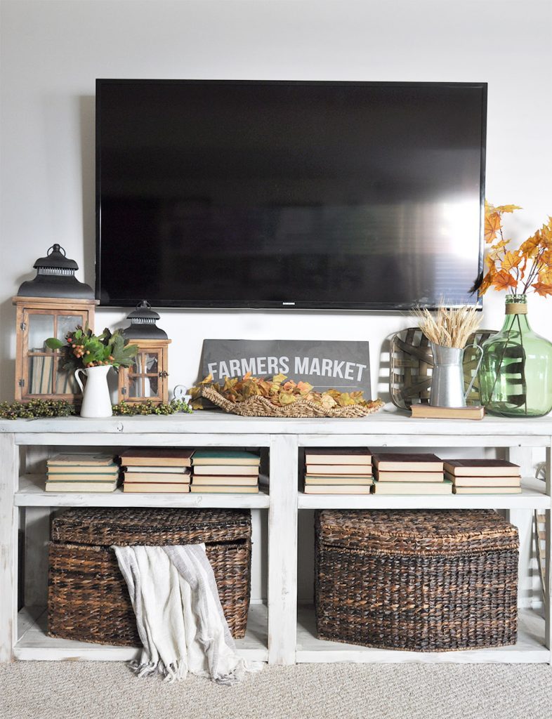 Gorgeous Fall Mantel Decor for when you don't have a mantel. See how this blogger decorates her TV Stand in place of a fireplace and mantel. 