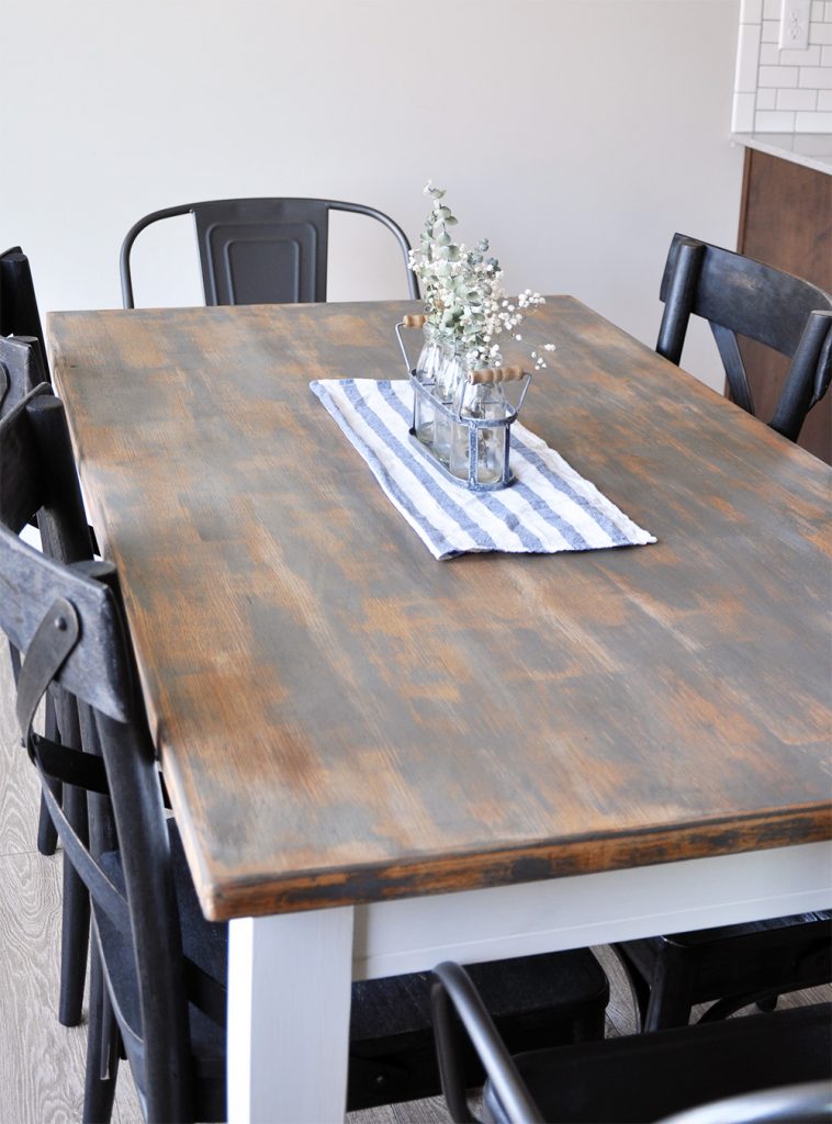 This table has seen an amazing transformation! Learn how to create the perfect Farmhouse Finish with this Farmhouse Dining Room Table Makeover. 