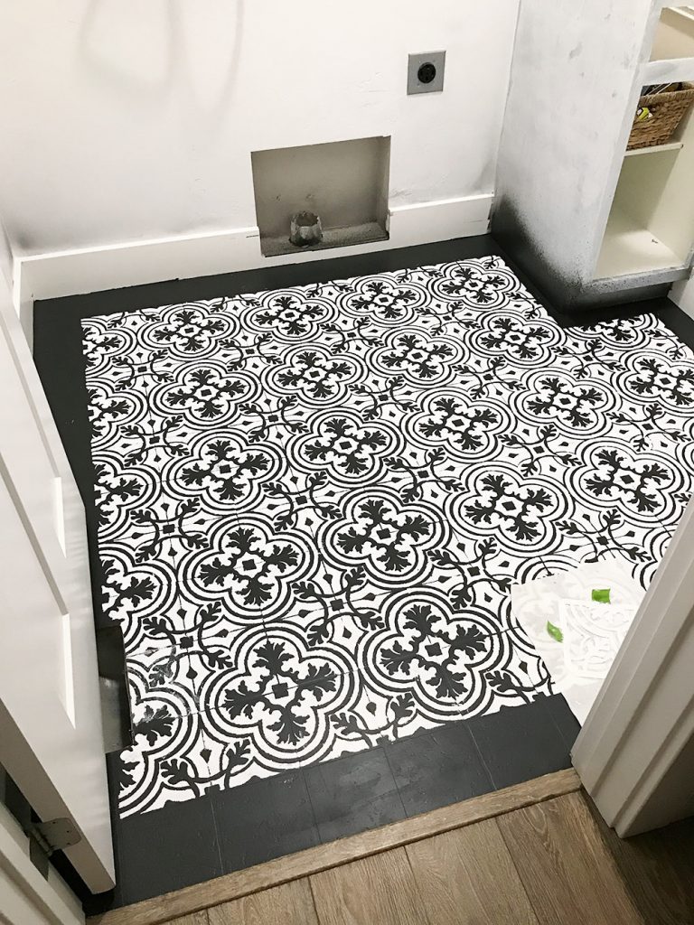 Got ugly Vinyl Floors? With this step by step tutorial you can learn how to Paint Vinyl Floors to look like the trendy cement tile everyone loves!