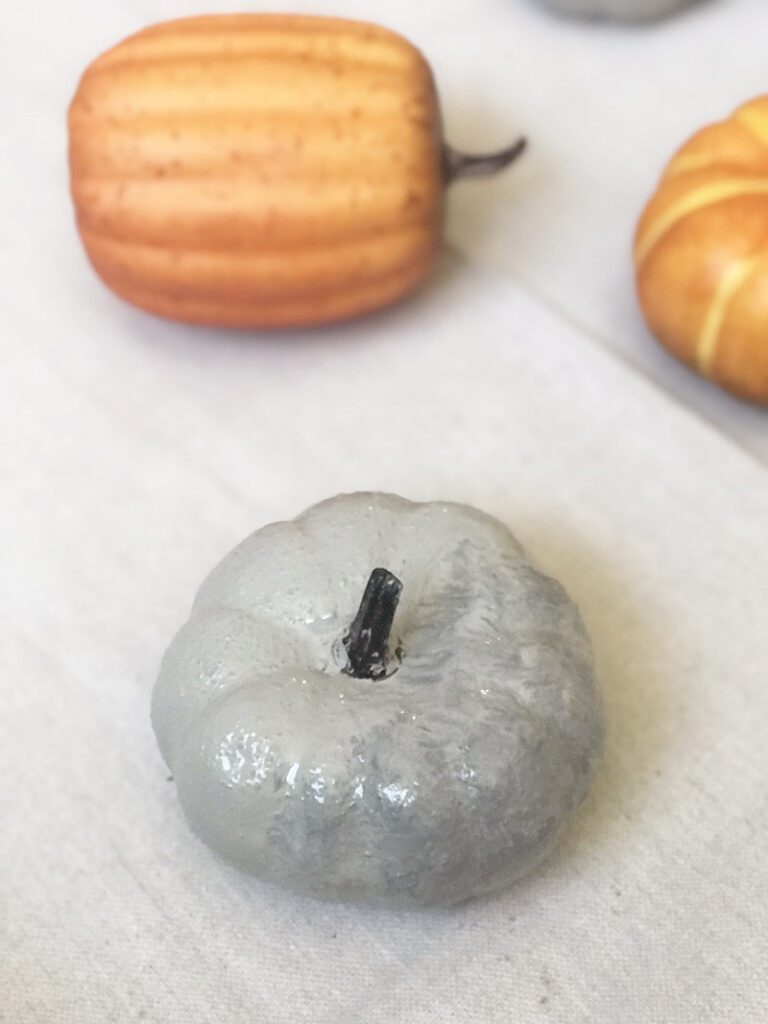 These easy to make Concrete Pumpkins don't require the actual use of concrete. Come see how easy it is to give anything the look of real concrete! 