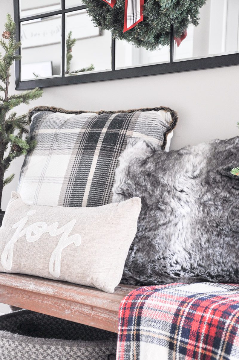 Come tour our Cozy Christmas Entryway decorated with comfy pillows, blankets and even a little hidden shoe storage!
