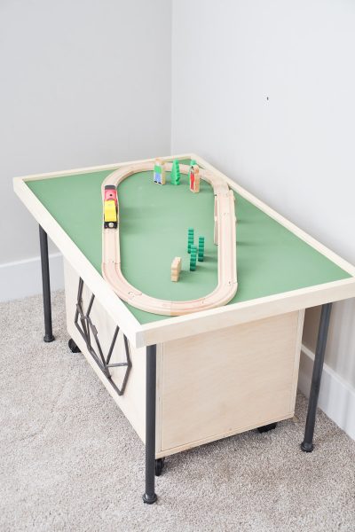 Do your kids love train tables but you don't have the space? This smaller, easily stored Space Saving DIY Train Table is the perfect solution!