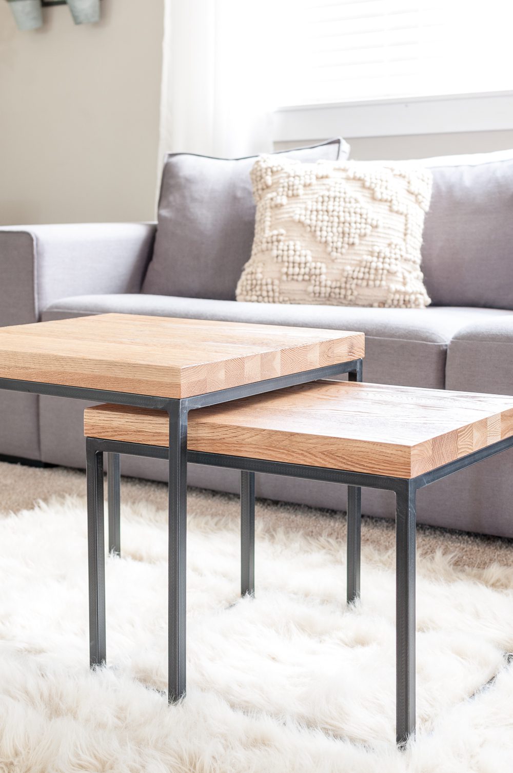 Nesting tables are the perfect addition to a minimalist living room providing surfaces that can also be space saving! 