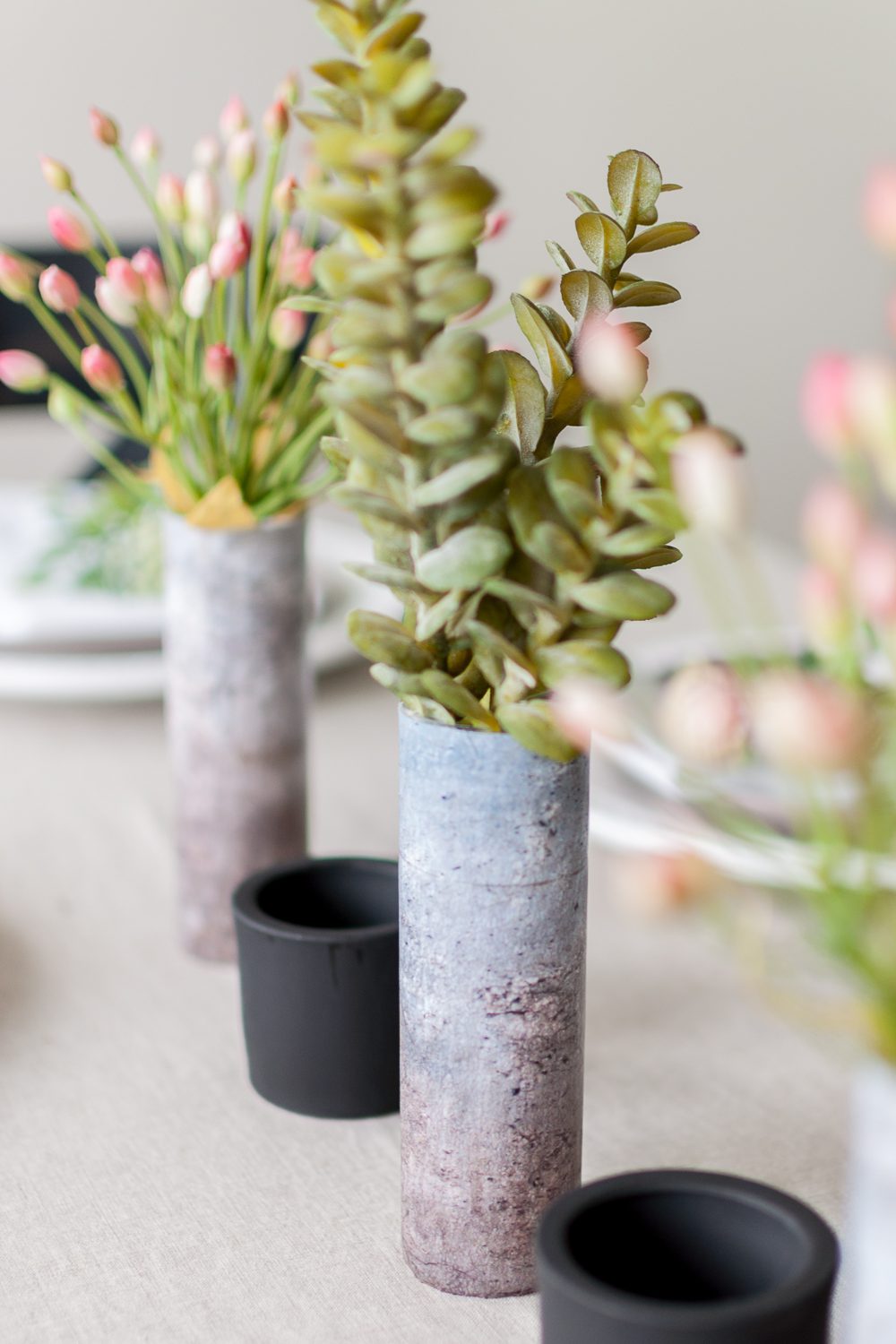 Use a little Dishwasher Safe Mod Podge to completely transform these small glass vases into a Faux Concrete Vase! This is such an easy and affordable project, visit Cherished Bliss for the how-to!