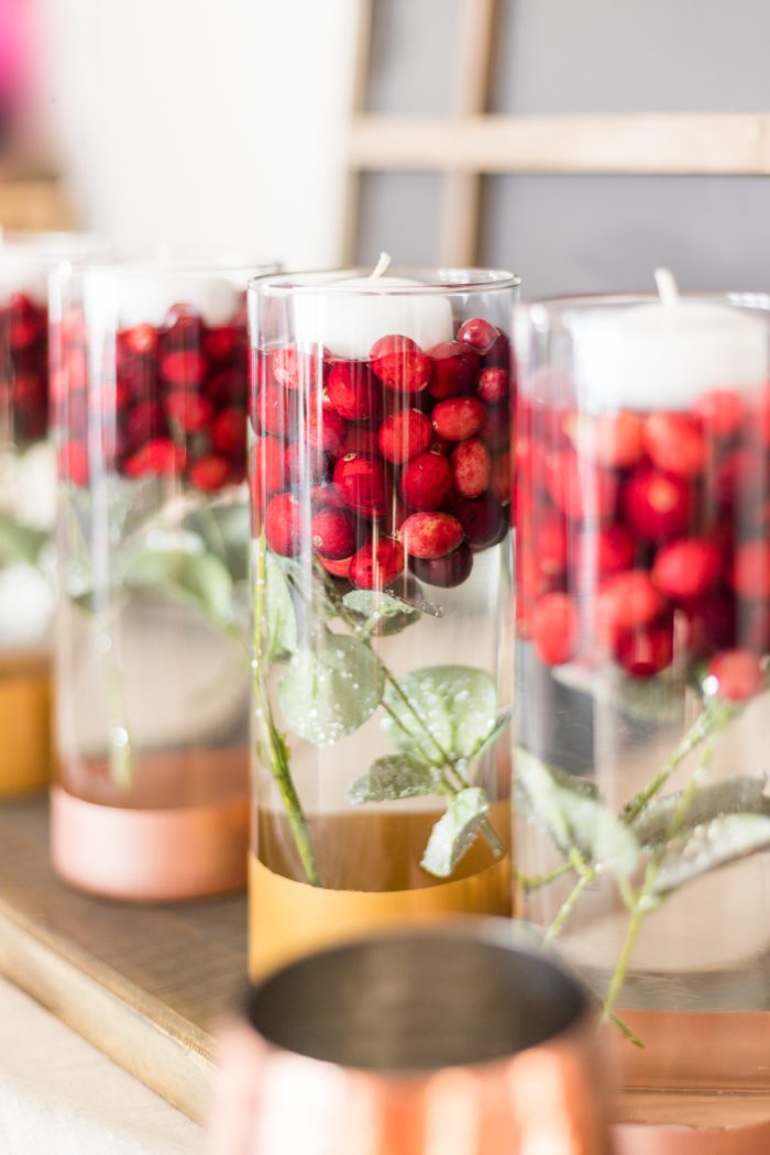 Create this gorgeous Cranberry Holiday Centerpiece using just a few craft supplies and easily transition from Thanksgiving to Christmas. 