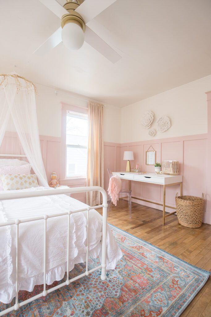 A beautiful Pink and Gold Girls Bedroom with a modern yet delicate touch, fun seating, and functional desk space perfect for all ages!