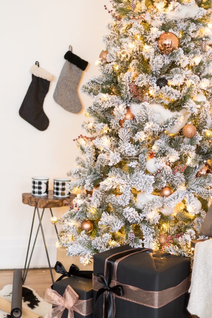 This Flocked White and Copper Christmas Tree brings coziness into any space! Learn how to decorate a tree with these simple tips! 