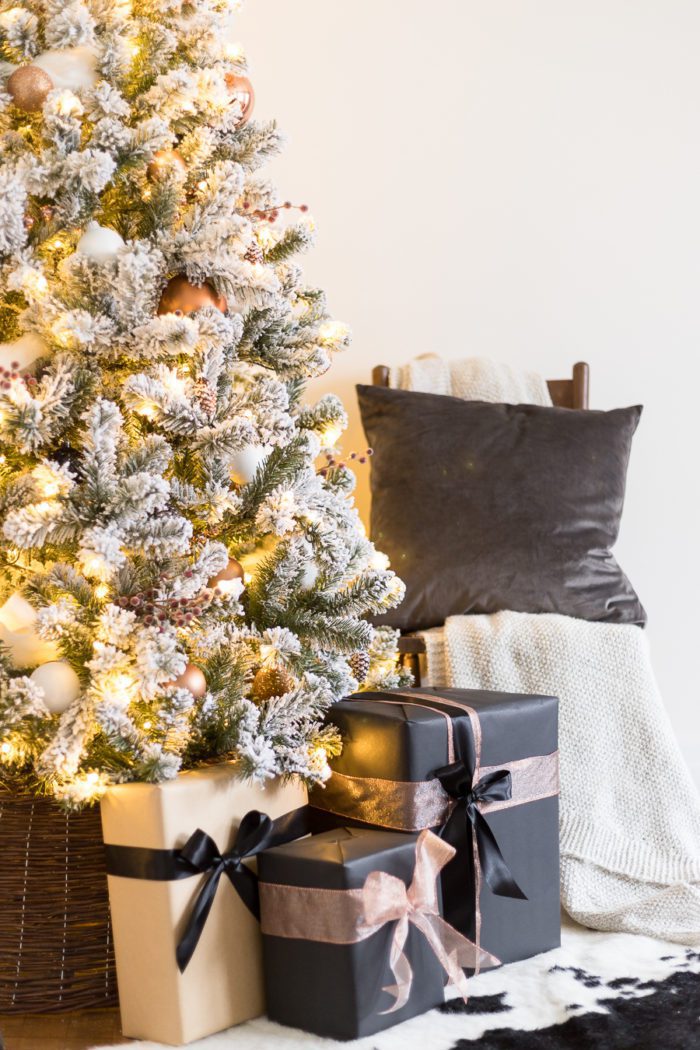 This Flocked White and Copper Christmas Tree brings coziness into any space! Learn how to decorate a tree with these simple tips! 
