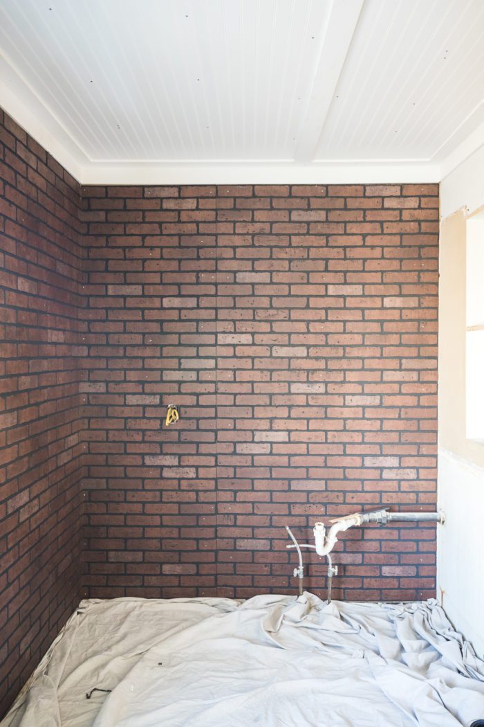 Brick wall panels used to create a faux brick wall in a kitchenette. 
