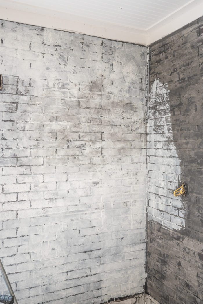 layer paint over the faux brick wall to get an industrial design. 