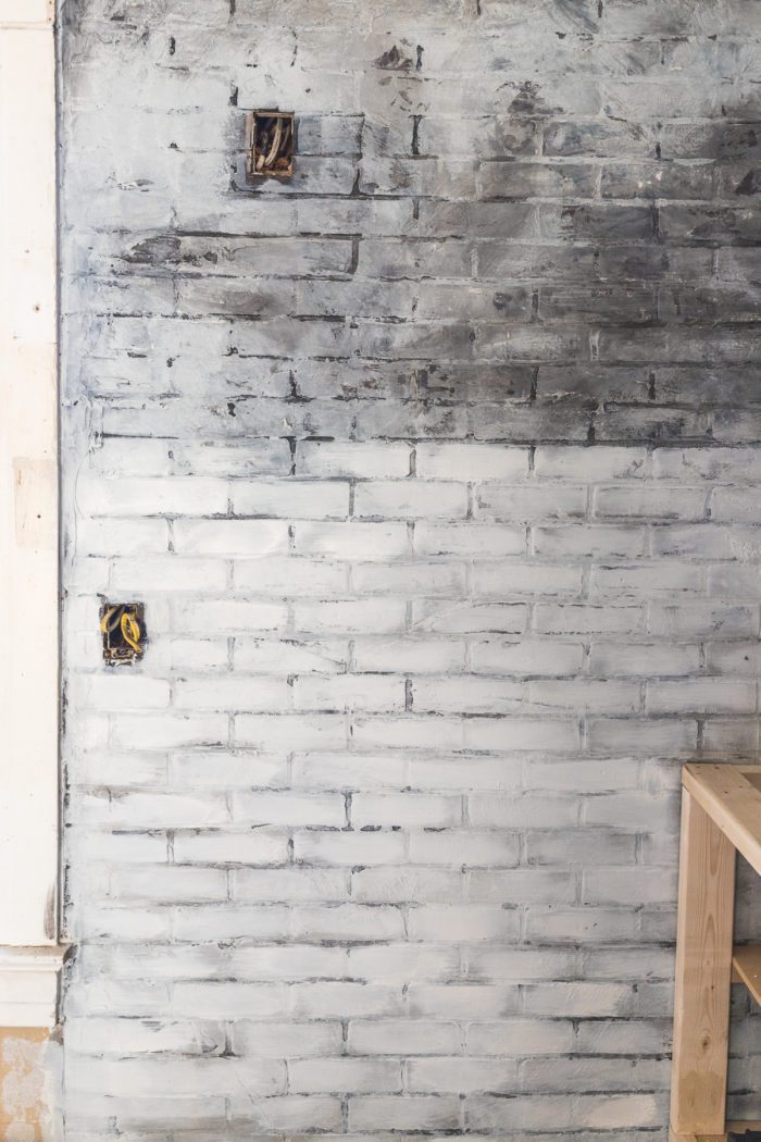 dry brush white paint over the faux brick wall to give the appearance of old worn brick with layers of paint. 
