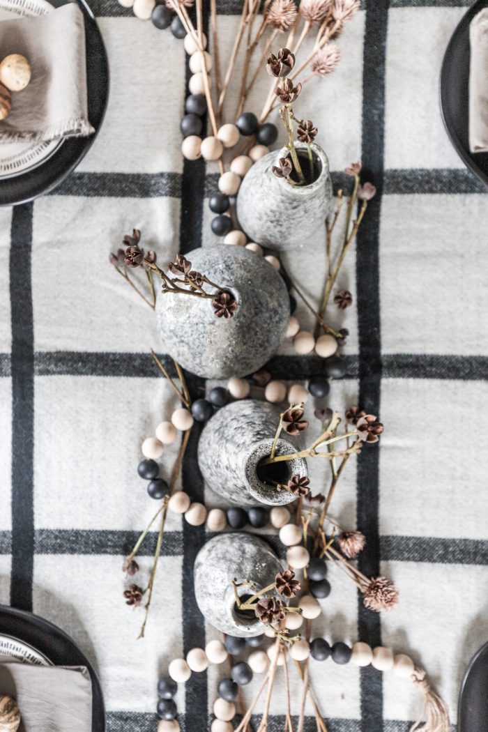Gray vases and modern natural decor for a Thanksgiving Tablescape.