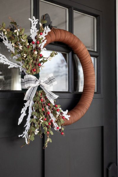 Modern Christmas Wreathing hanging on Black Door