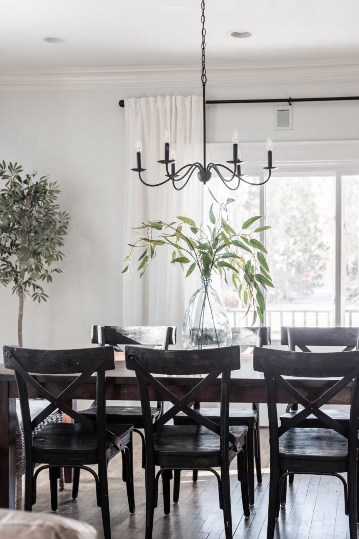 Simple formal dining room decor with black accents. 