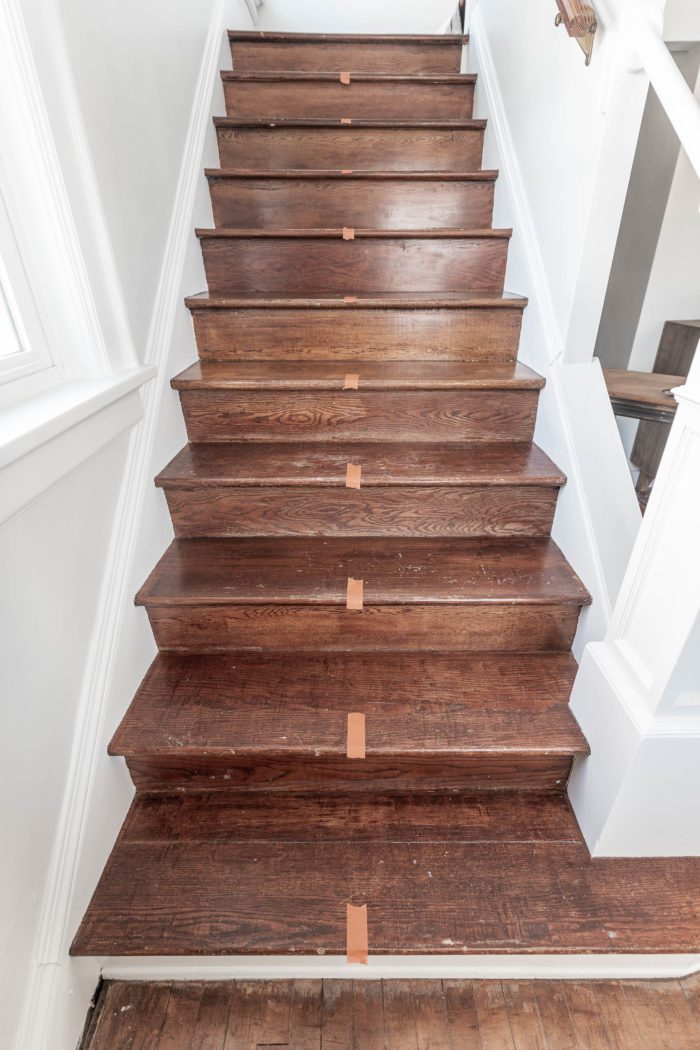 Mark the center of your wood stairs. 