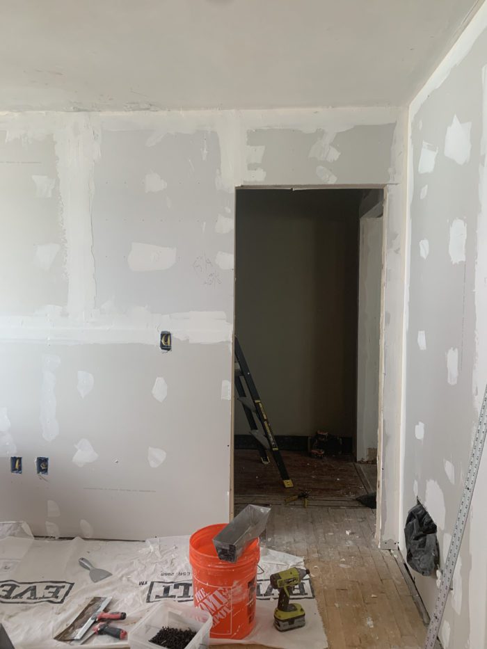 Progress photo of Master Bedroom. The built in closet has been removed and the doorway moved over to allow for the hallway to be extended. 