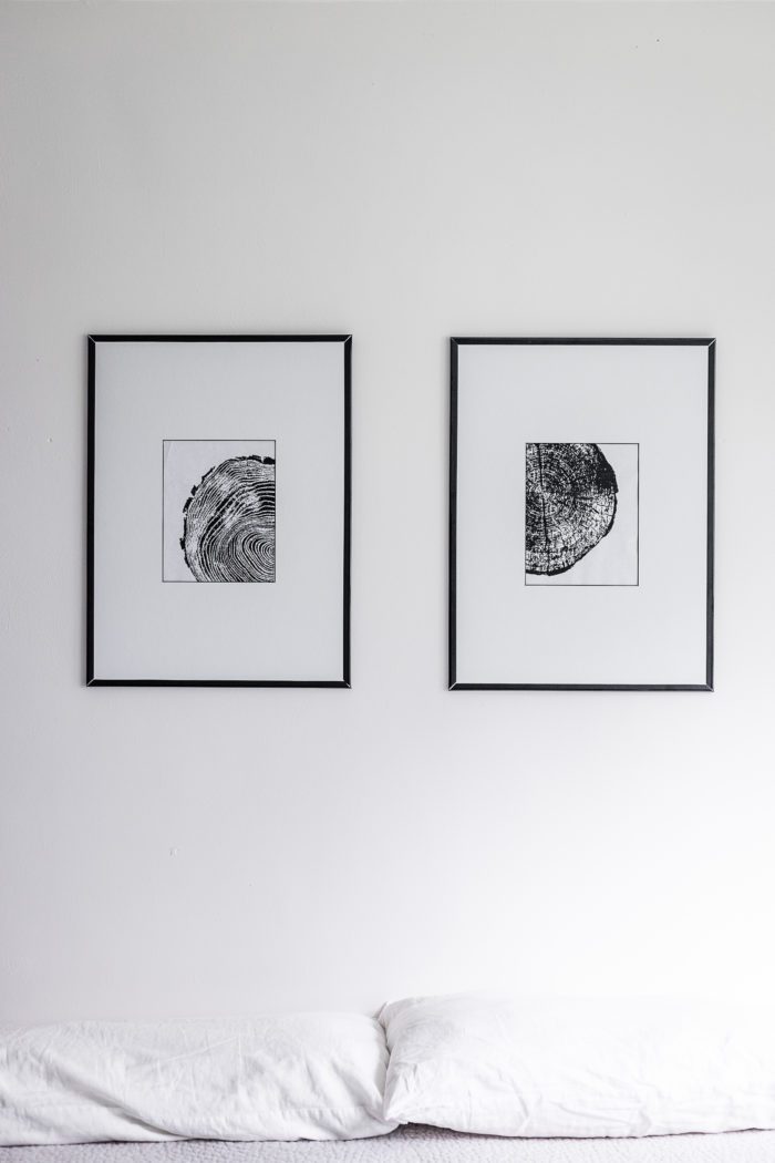 Thin black frame with tree ring art