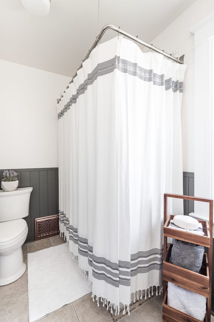 Using two shower curtains for two sided tub. 
