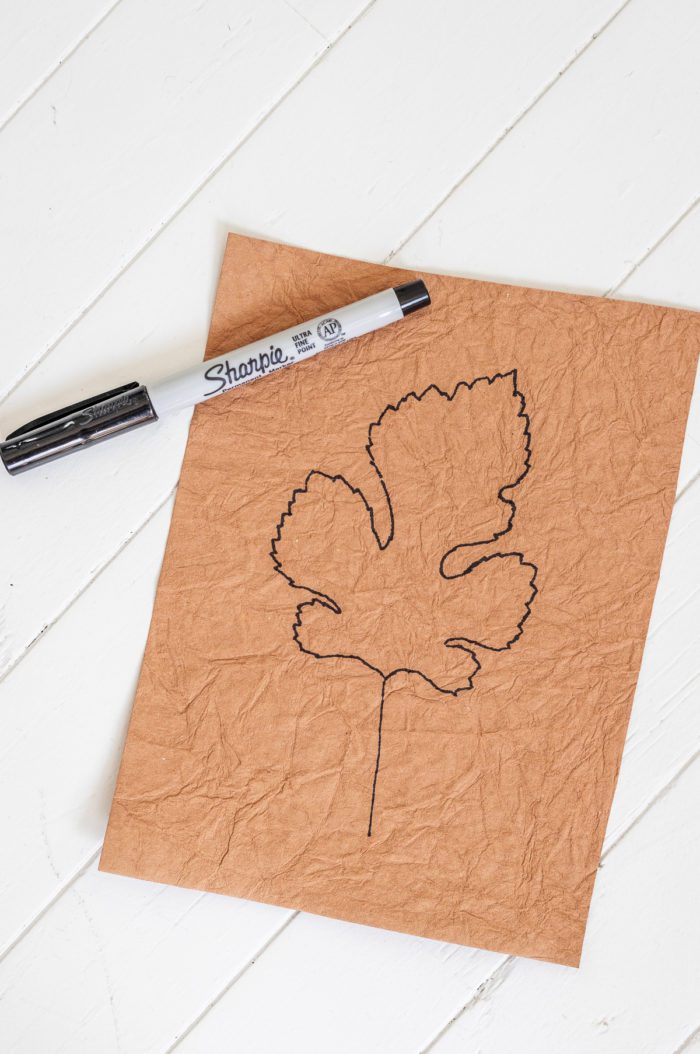 Trace a leaf on scrapbook paper and frame it for Easy Fall Decor
