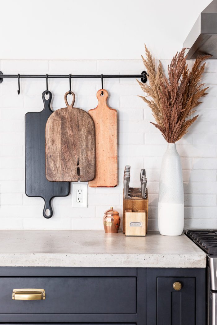 Hanging cutting boards on kitchen backsplash with Fall Decor. 