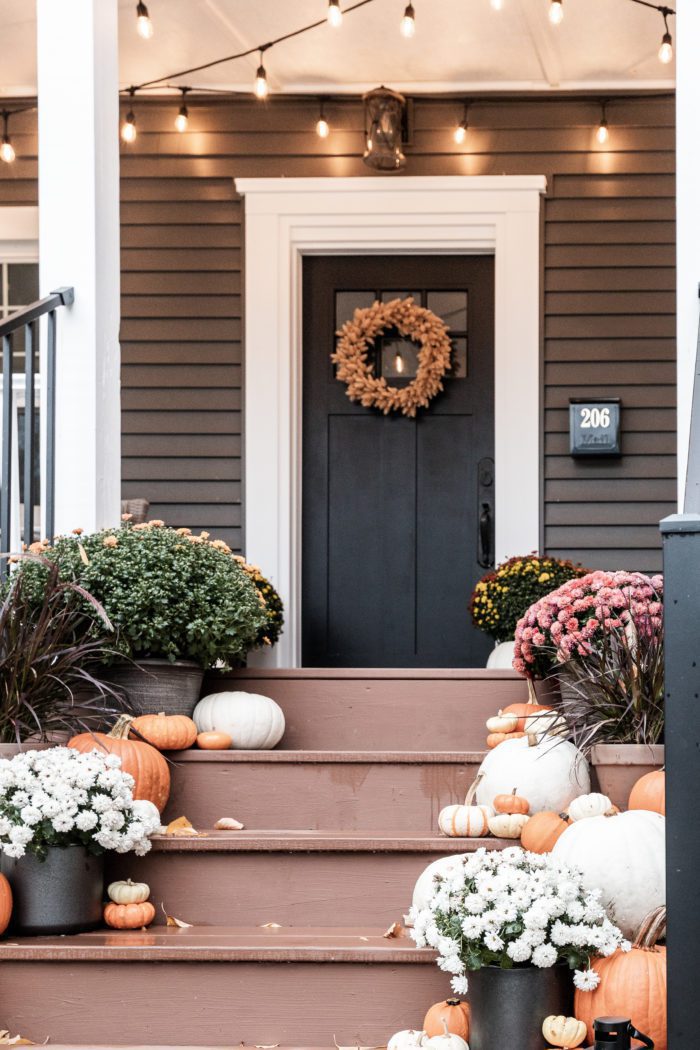 Pumpkins and Mum on Front Porch Stairs and wreath on Door