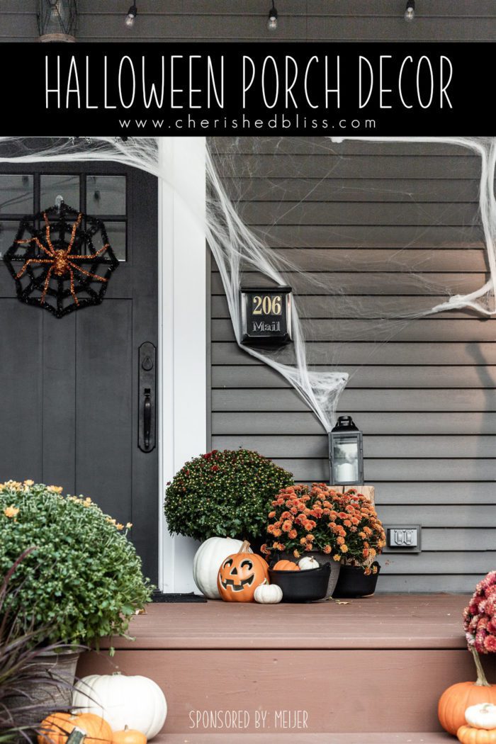 Halloween Porch Decor with spider webs, mums, and pumpkins