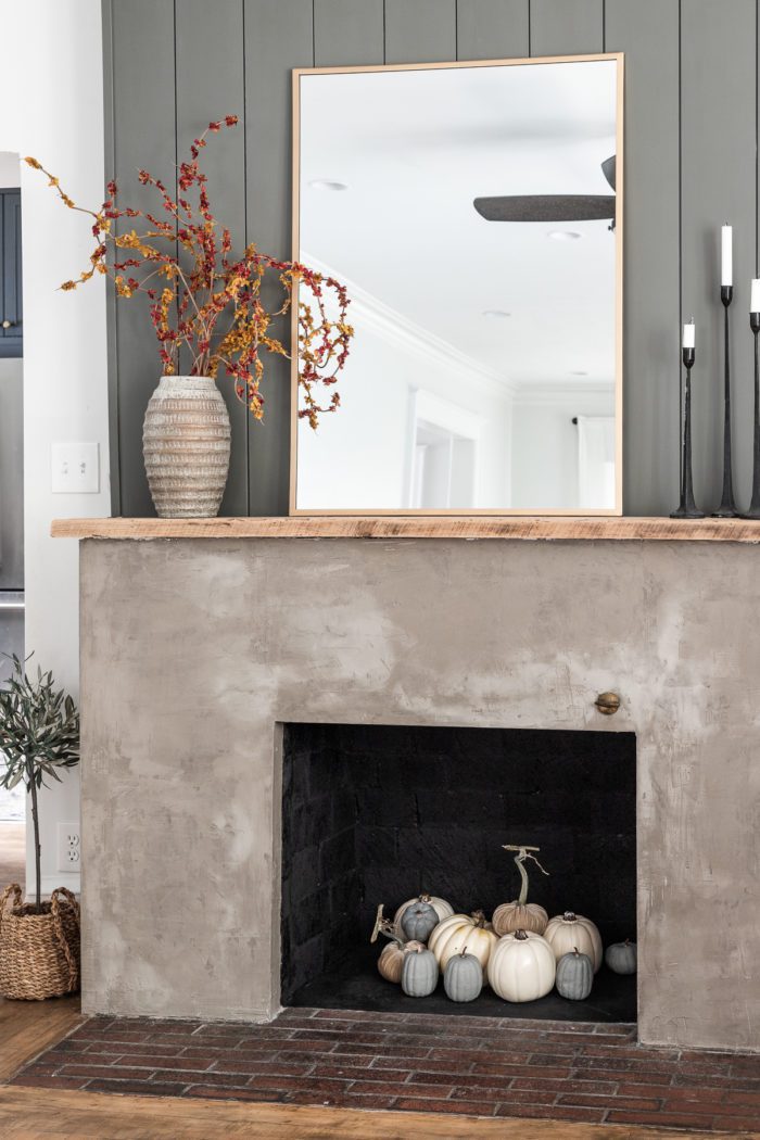 Concrete fireplace with pumpkins. 