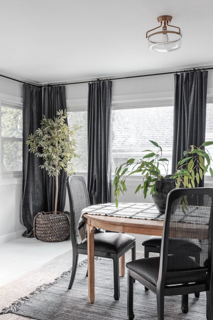Black curtains in breakfast room makeover. 