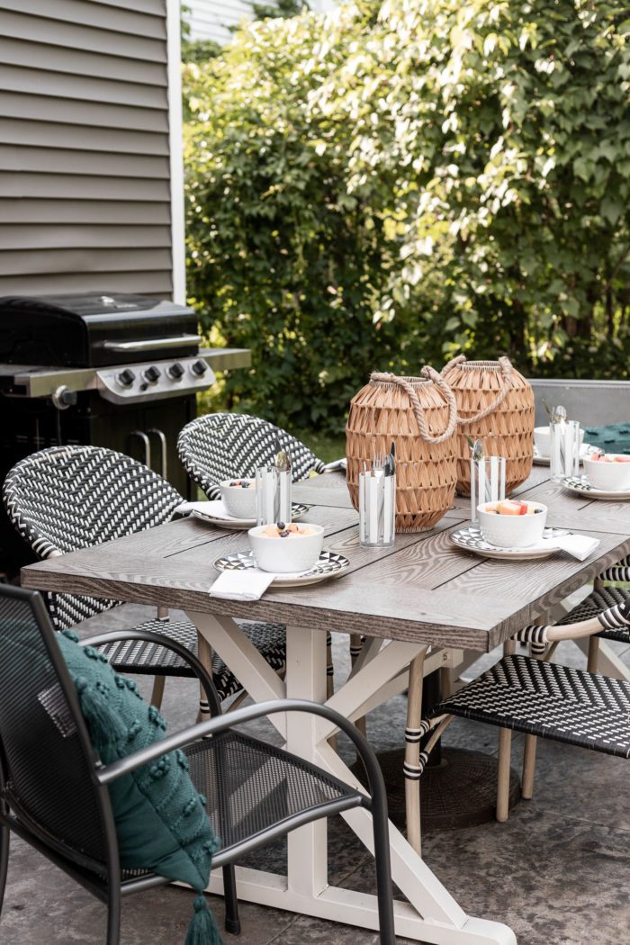 An Outdoor Summer Tablescape on a stamped concrete patio is the perfect way to enjoy a family meal this summer.