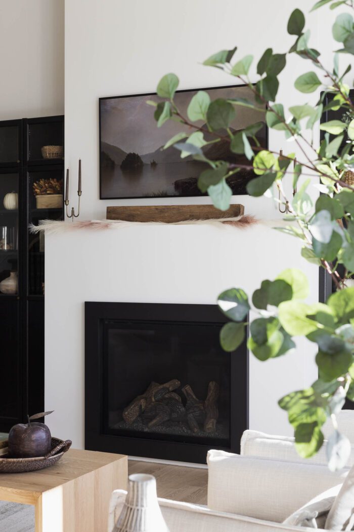 Modern Plaster Fireplace with Fall Decor giving it a Modern European Vibe. 