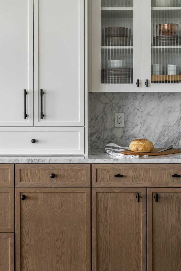White Oak & painted white cabinets created a beautiful two toned Modern European-Inspired kitchen 