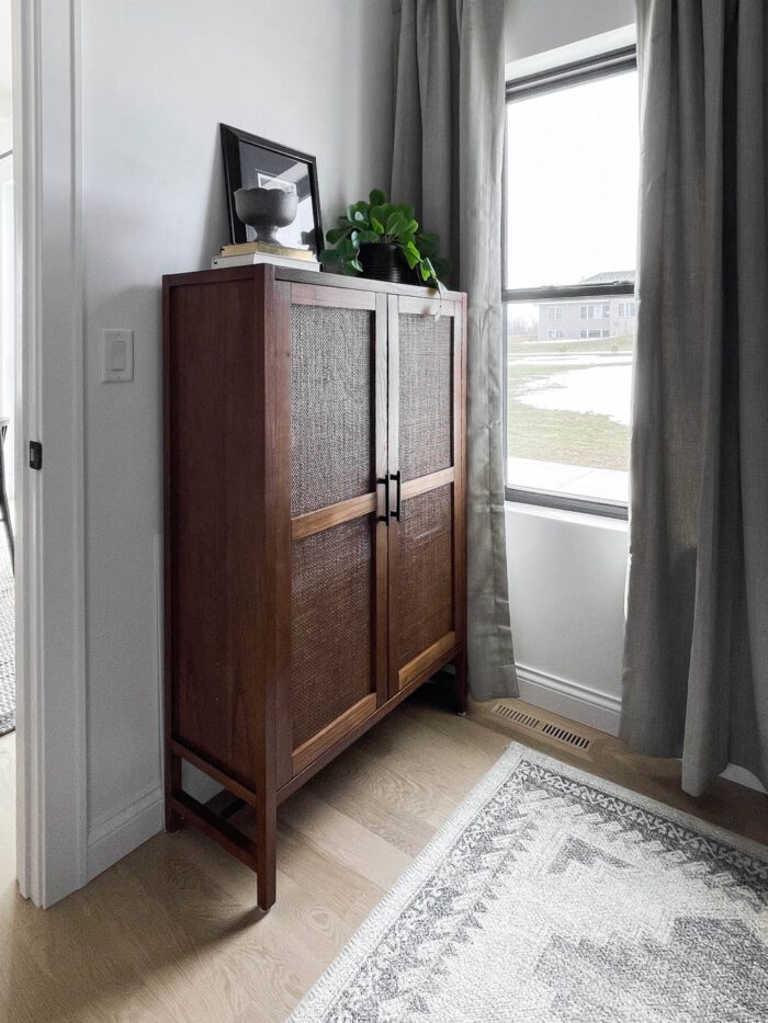 A storage cabinet in a small home office is the perfect way to keep things out of sight and organized. 
